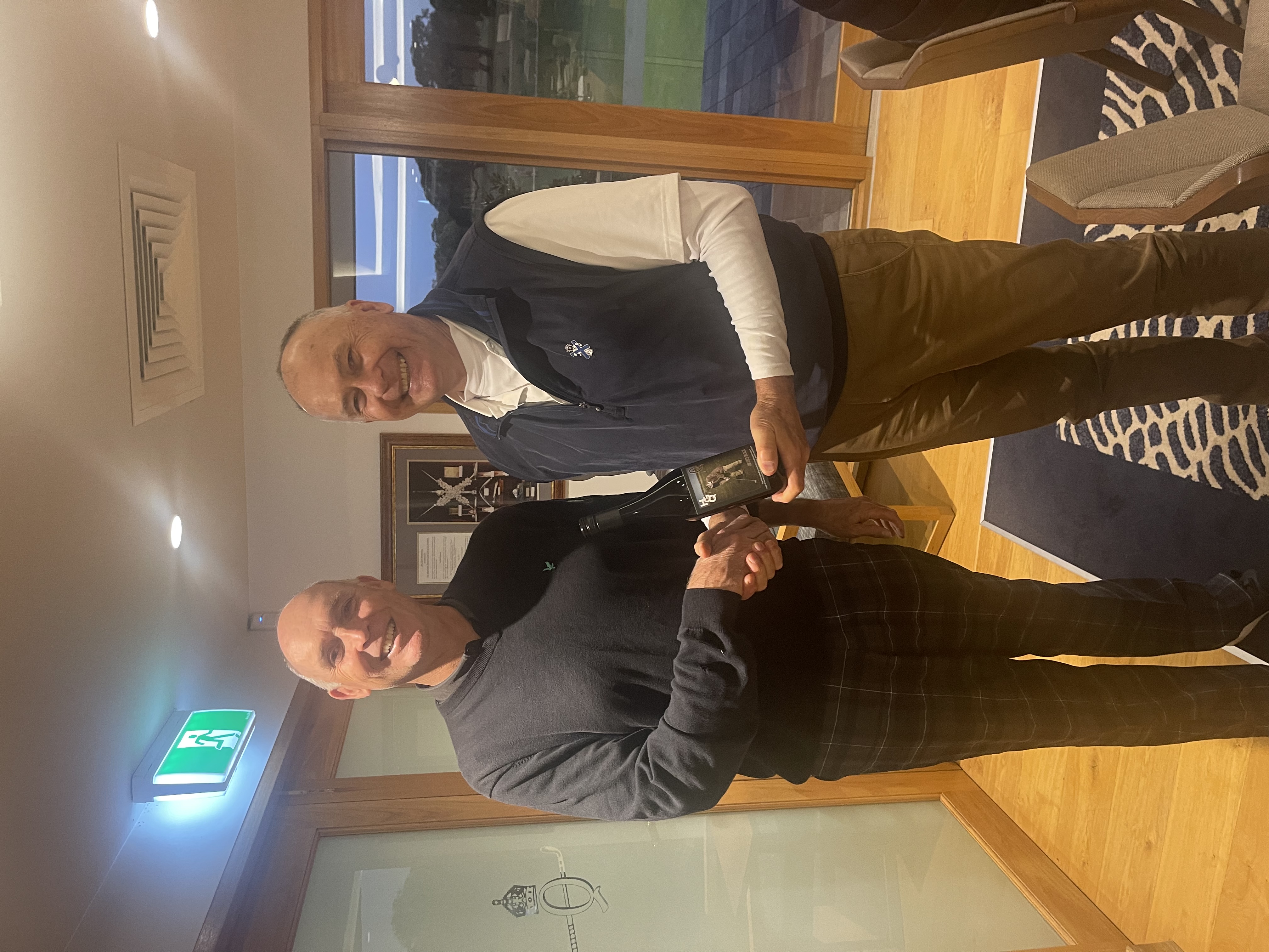 Chris Cooper receiving the winners wine