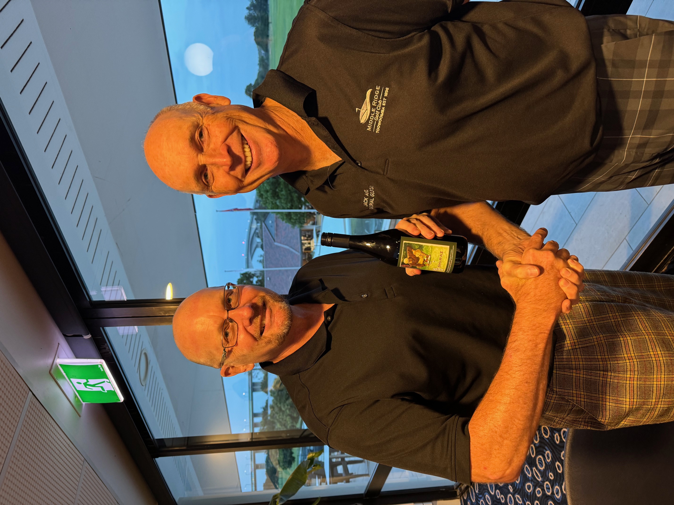 Peter Kyffin picks up the wine.